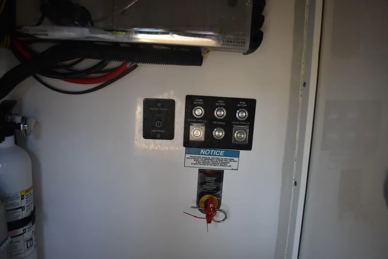 Slide: The Image of Control panel of 2024 Regal 36 XO boat with fire extinguisher and wiring. - 9