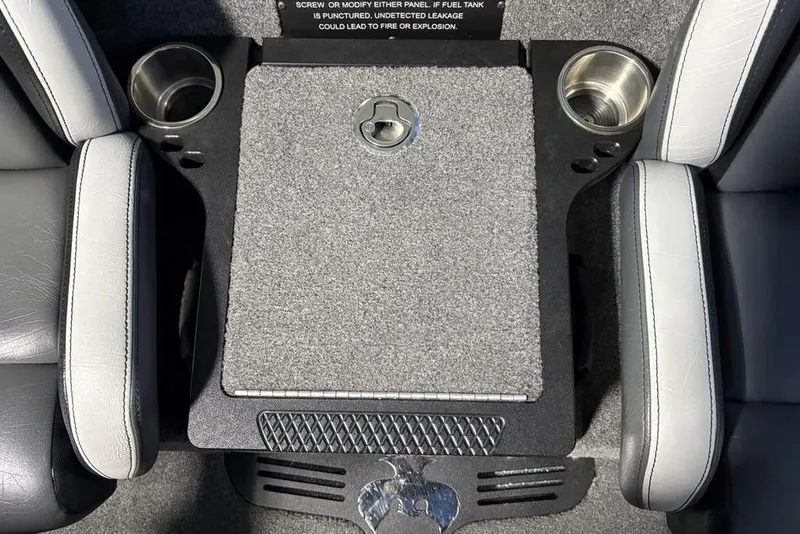 Slide: The Image of 2024 Phoenix 920 Elite boat interior with cup holders and storage compartment. - 11