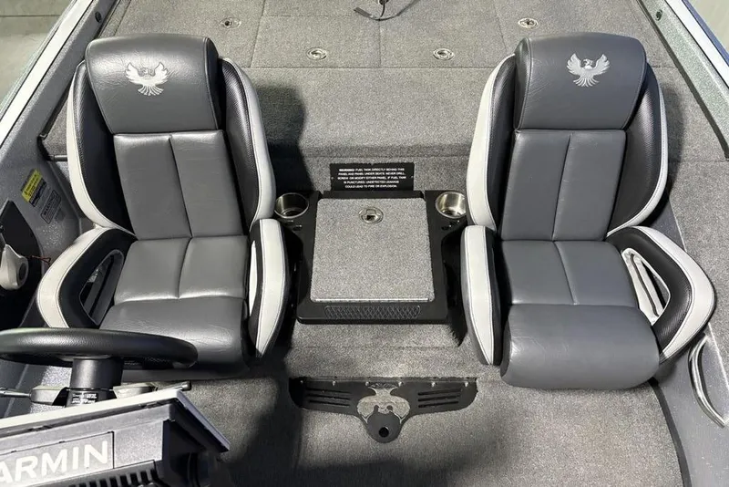 Slide: The Image of 2024 Phoenix 920 Elite boat interior with dual gray seats and Garmin equipment. - 13