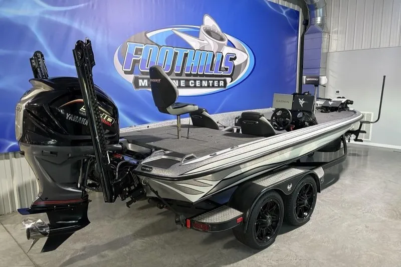 Slide: The Image of 2024 Phoenix 920 Elite boat displayed at Foothills Marine Center showroom. - 2