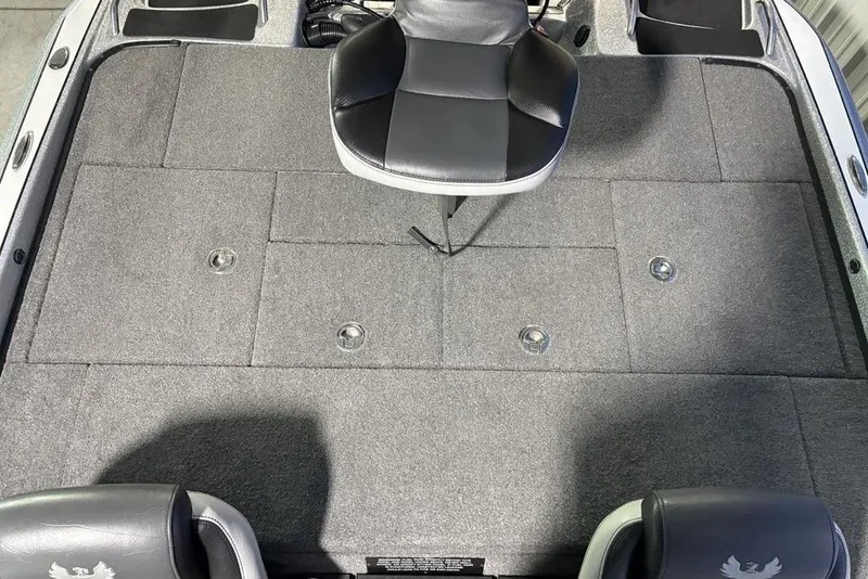 Slide: The Image of 2024 Phoenix 920 Elite boat interior with gray carpet and seating arrangement. - 23