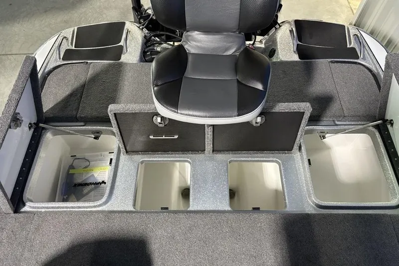 Slide: The Image of 2024 Phoenix 920 Elite boat interior with storage compartments and seating. - 26