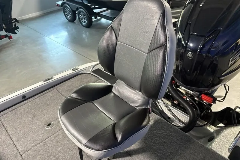 Slide: The Image of 2024 Phoenix 920 Elite boat seat with sleek black and gray design. - 31