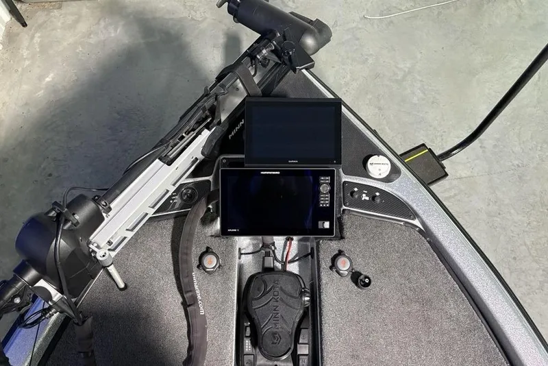 Slide: The Image of 2024 Phoenix 920 Elite boat dashboard with advanced navigation and control systems. - 4