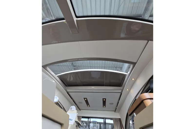 Slide: The Image of Interior view of 2017 Sea Ray Sundancer 400 yacht with skylight and modern design. - 11