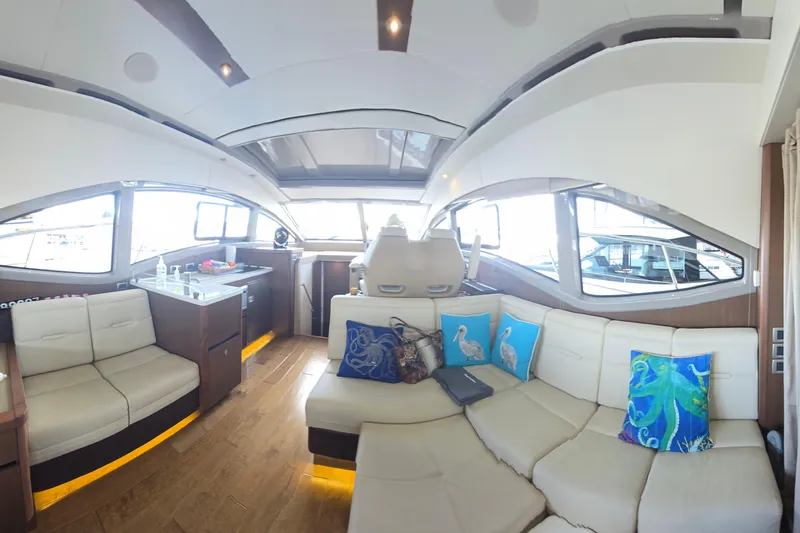 Slide: The Image of Luxurious interior of 2017 Sea Ray Sundancer 400 yacht with plush seating and vibrant decor. - 12