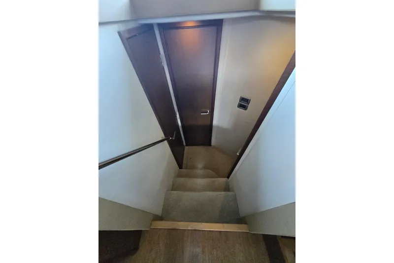 Slide: The Image of Staircase leading to cabin door inside 2017 Sea Ray Sundancer 400 yacht. - 15