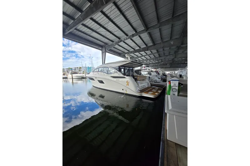 Slide: The Image of Luxurious 2017 Sea Ray Sundancer 400 cabin interior with cozy bed and modern design. - 18