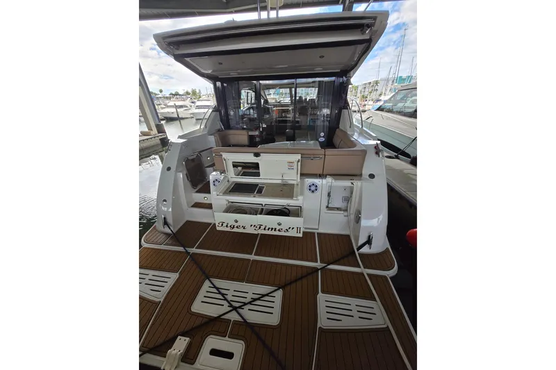 Slide: The Image of Interior cabin of 2017 Sea Ray Sundancer 400 with cozy bedding and storage. - 21