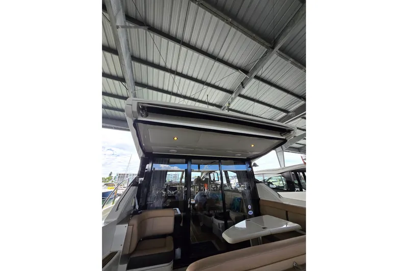 Slide: The Image of 2017 Sea Ray Sundancer 400 yacht covered with protective tarp in marina. - 24