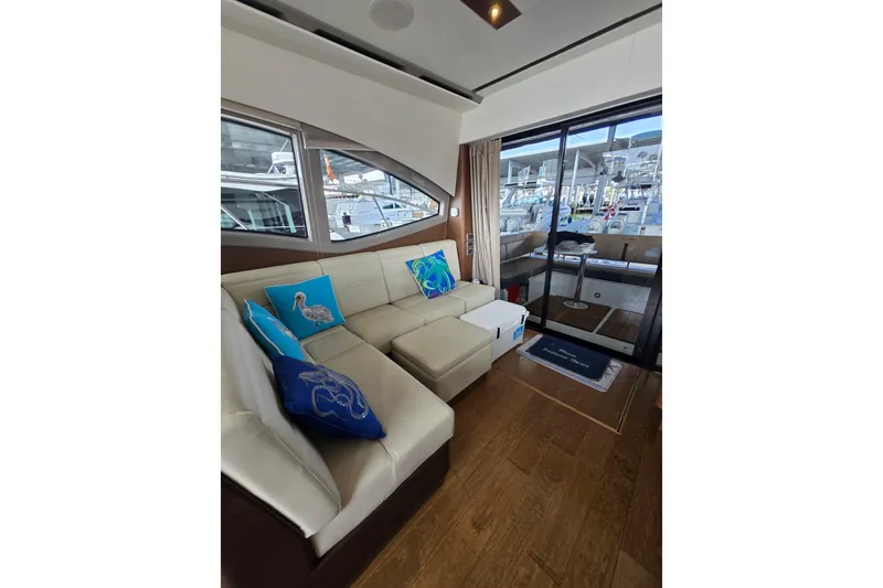 Slide: The Image of 2017 Sea Ray Sundancer 400 with beige sunpad and black cover on deck. - 25
