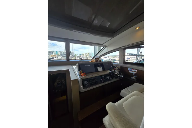 Slide: The Image of Engine compartment of a 2017 Sea Ray Sundancer 400 boat, showcasing mechanical components. - 28