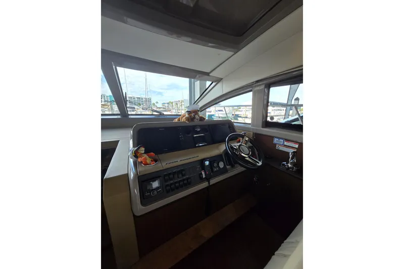 Slide: The Image of Engine compartment of 2017 Sea Ray Sundancer 400, showcasing mechanical components and wiring. - 29