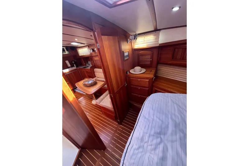Slide: The Image of Interior of 2004 Sabre 42 Hardtop Express yacht with wood finish and cozy seating area. - 20
