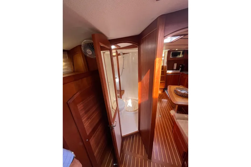 Slide: The Image of Interior of 2004 Sabre 42 Hardtop Express yacht with wooden finishes and cozy cabin. - 21