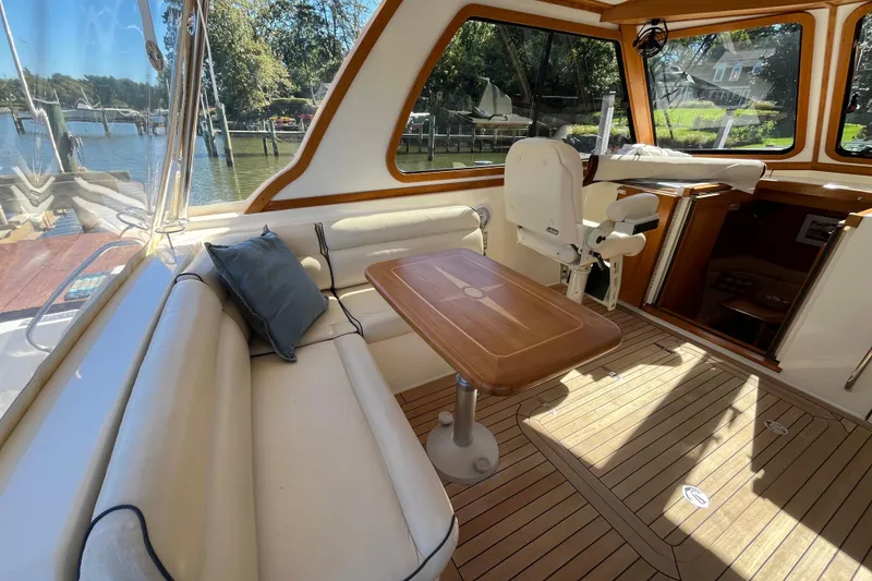 Slide: The Image of Luxurious interior of 2004 Sabre 42 Hardtop Express yacht with seating and table. - 4