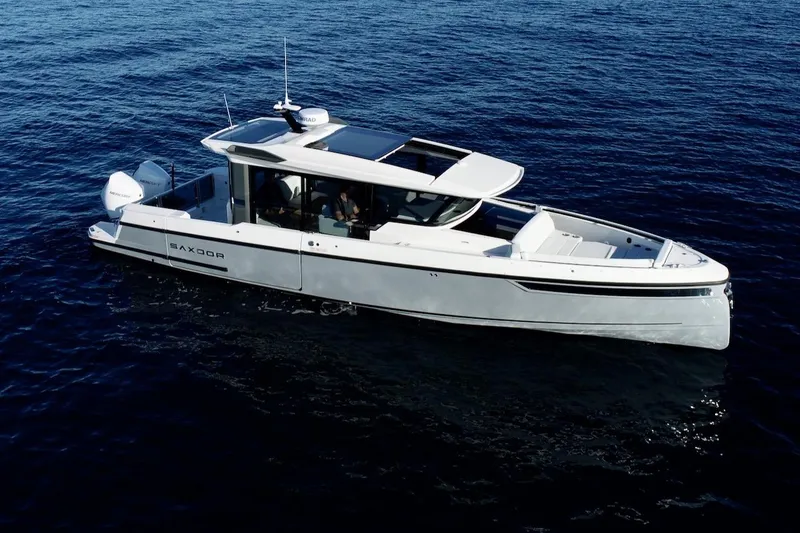 Slide: The Image of 2026 Saxdor 340 GTWA boat cruising on open water. - 25