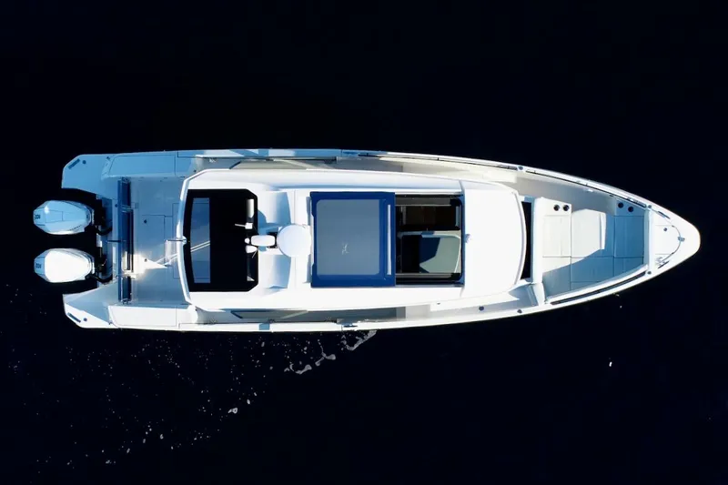 Slide: The Image of Overhead view of 2026 Saxdor 340 GTWA boat on dark water. - 26