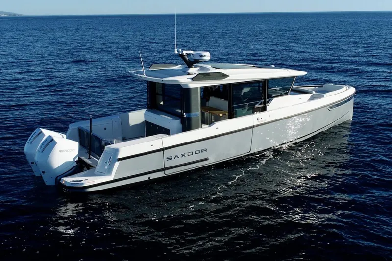 Slide: The Image of 2026 Saxdor 340 GTWA boat cruising on open water. - 28