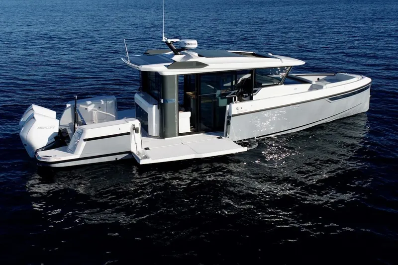 Slide: The Image of 2026 Saxdor 340 GTWA boat on calm blue water, side view. - 30