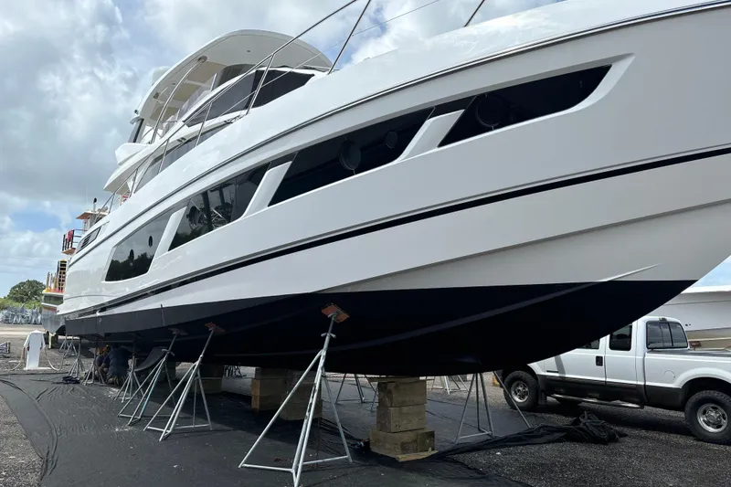 Slide: The Image of 2016 Sunseeker Manhattan 65 yacht on dry dock, side view. - 25