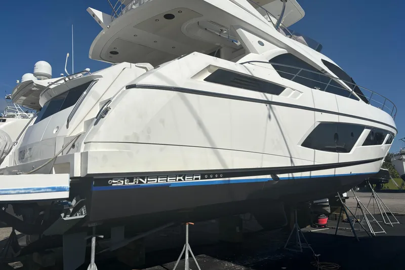 Slide: The Image of 2016 Sunseeker Manhattan 65 yacht on dry dock under clear blue sky. - 27