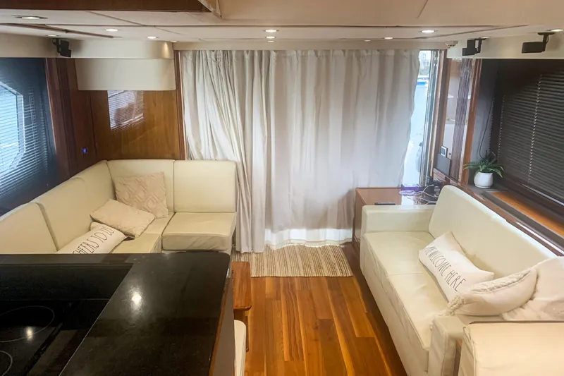 Slide: The Image of Luxurious interior of 2016 Sunseeker Manhattan 65 yacht with elegant seating and wooden flooring. - 3