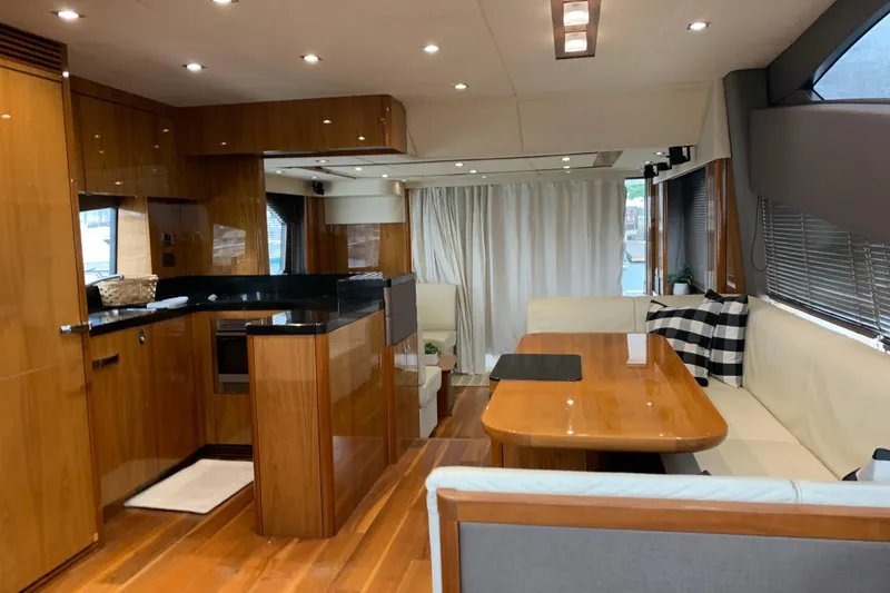 Slide: The Image of Luxurious interior of 2016 Sunseeker Manhattan 65 yacht with modern kitchen and dining area. - 8