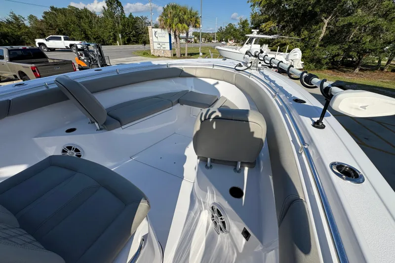 Slide: The Image of 2024 Sportsman Open 302 Center Console boat interior with seating and rod holders. - 15