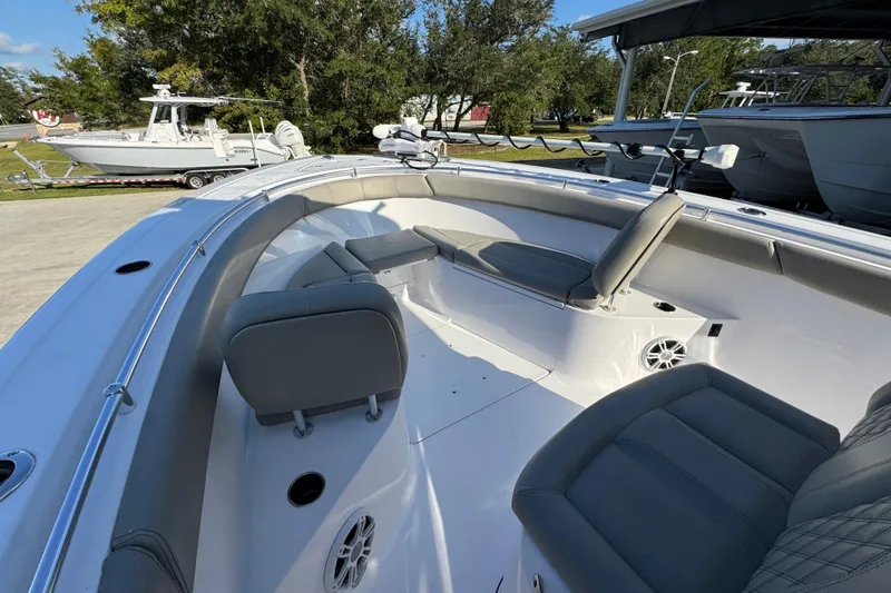 Slide: The Image of 2024 Sportsman Open 302 Center Console boat interior with seating and speakers. - 17