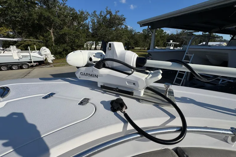 Slide: The Image of 2024 Sportsman Open 302 Center Console with Garmin marine equipment on deck. - 18