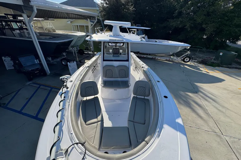 Slide: The Image of 2024 Sportsman Open 302 Center Console boat with spacious seating and modern design. - 20