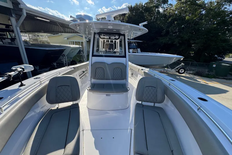 Slide: The Image of 2024 Sportsman Open 302 Center Console boat with spacious seating and modern design. - 21