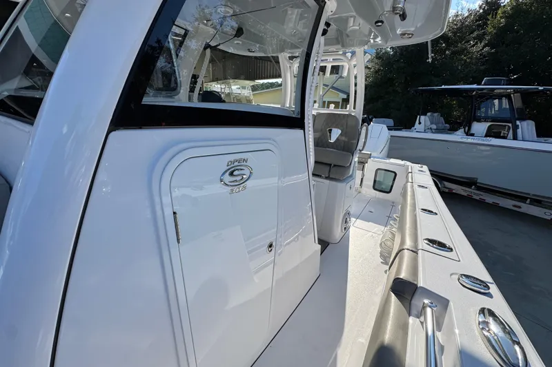 Slide: The Image of 2024 Sportsman Open 302 Center Console boat, showcasing sleek design and modern features. - 23