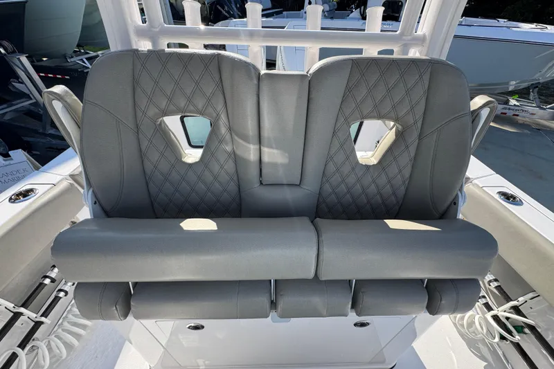 Slide: The Image of 2024 Sportsman Open 302 Center Console boat seats with diamond stitching and armrests. - 28