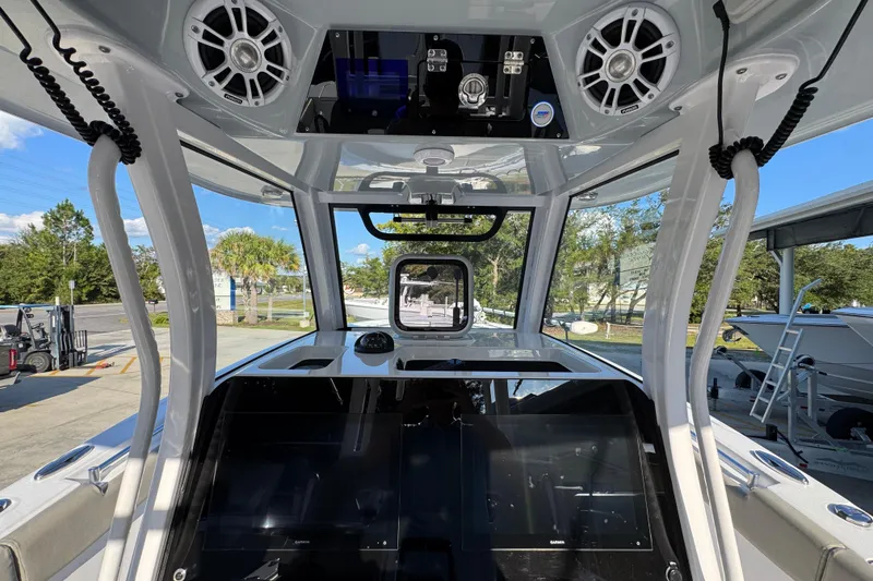 Slide: The Image of 2024 Sportsman Open 302 Center Console interior with advanced navigation and audio systems. - 32