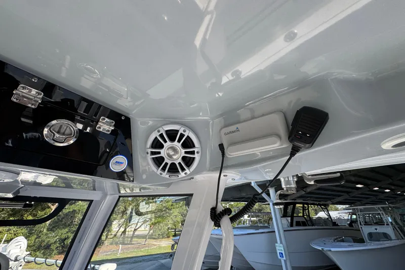 Slide: The Image of 2024 Sportsman Open 302 Center Console interior with Garmin electronics and Fusion speaker system. - 34