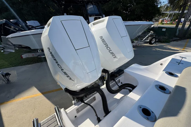Slide: The Image of 2024 Sportsman Open 302 Center Console with dual Mercury outboard engines. - 50