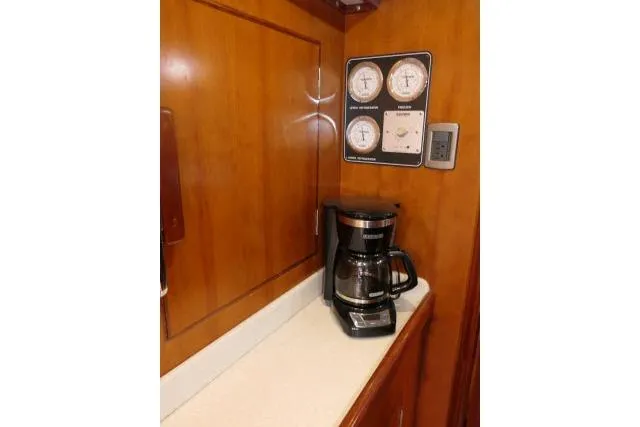 Slide: The Image of Sink area in 2006 Tayana 58 Deck Salon yacht with faucet and paper towel. - 14