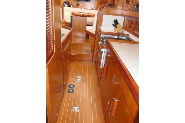Slide: The Image of Interior of 2006 Tayana 58 Deck Salon with navigation equipment and model car. - 16