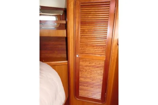 Slide: The Image of Interior of 2006 Tayana 58 Deck Salon yacht with wood paneling and TV. - 24