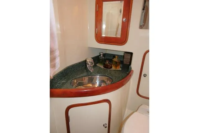 Slide: The Image of Shower area in 2006 Tayana 58 Deck Salon yacht with wooden floor slats. - 36