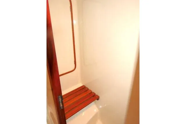 Slide: The Image of 2006 Tayana 58 Deck Salon interior with cozy seating and nautical decor. - 37