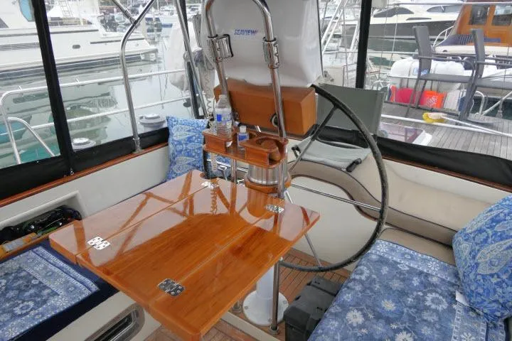 Slide: The Image of Cockpit of 2006 Tayana 58 Deck Salon with navigation equipment and wooden accents. - 41