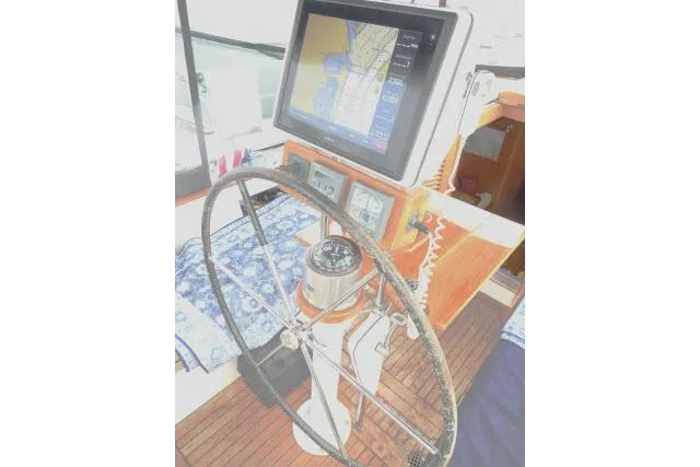 Slide: The Image of Cockpit of 2006 Tayana 58 Deck Salon with navigation equipment and steering wheel. - 45