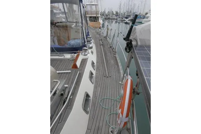 Slide: The Image of 2006 Tayana 58 Deck Salon yacht with sleek design and spacious deck. - 50