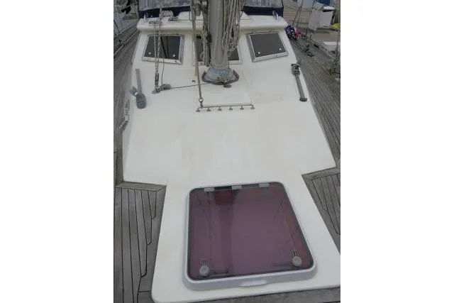 Slide: The Image of 2006 Tayana 58 Deck Salon sailboat deck with mast and rigging details. - 52