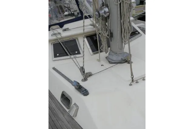Slide: The Image of 2006 Tayana 58 Deck Salon sailboat deck with rigging and blue cushions. - 53