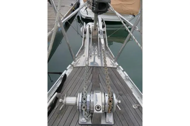 Slide: The Image of 2006 Tayana 58 Deck Salon yacht docked in marina, featuring sleek design and modern equipment. - 61