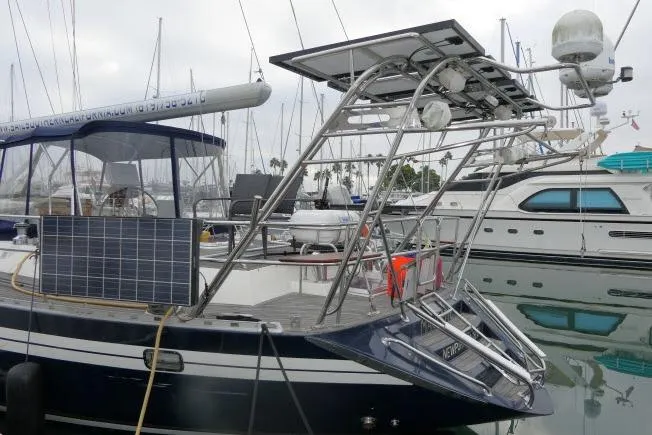 Slide: The Image of 2006 Tayana 58 Deck Salon yacht docked, featuring sleek design and modern amenities. - 64